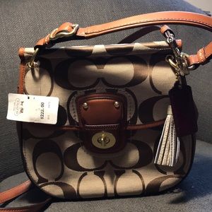 A coach brown and tan a logo purse